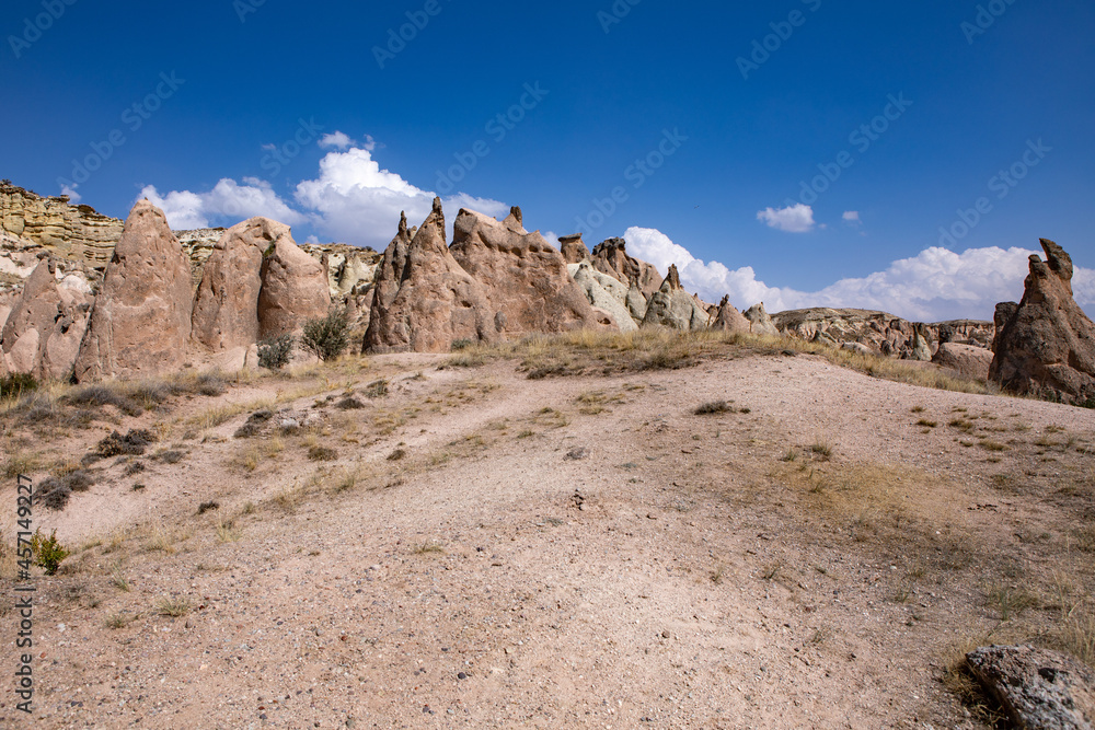 Cappadocia, Turkey - September 1, 2021 – Impressive nature by chimney rock formations and rock pillars of “love Valley” near Goreme, Cappadocia, Nevsehir, Turkey