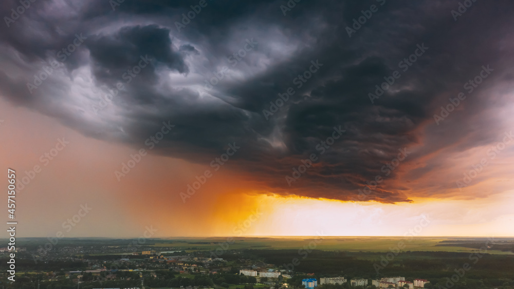 Stormy Sunset Sky Before Rain Above Skyline. Dramatic Cloudy Sky And Flash Light Stormy Sunset Sky Before Rain Above Skyline. Dramatic Cloudy Sky And Flash Light