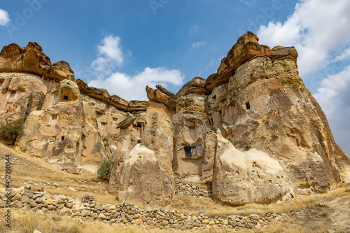 Cappadocia, Turkey - September 1, 2021 – Impressive ancient cave home which had been carved in the Vulcanic rock cliff face of Pigeon Valley at Uchisar in the Cappadocia region of Turkey.
