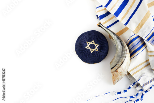 Yom kippur, Rosh hashanah, jewish New Year holiday, concept. Religion image of shofar - horn on white prayer talit. photo