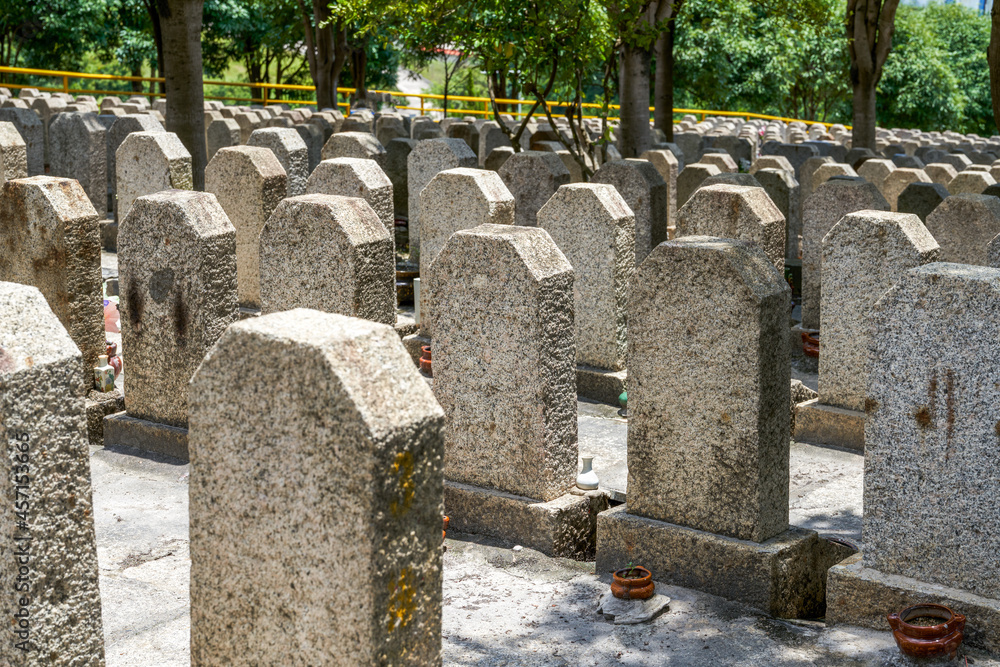 Rows of stone tombstones in a public cemetery Rows of stone tombstones in a public cemetery