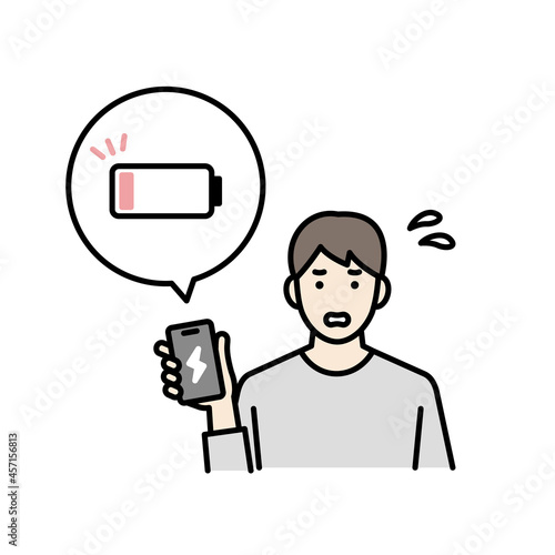 スマートフォンの充電が切れて焦る男性