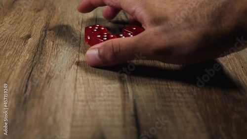 Man picking up dices