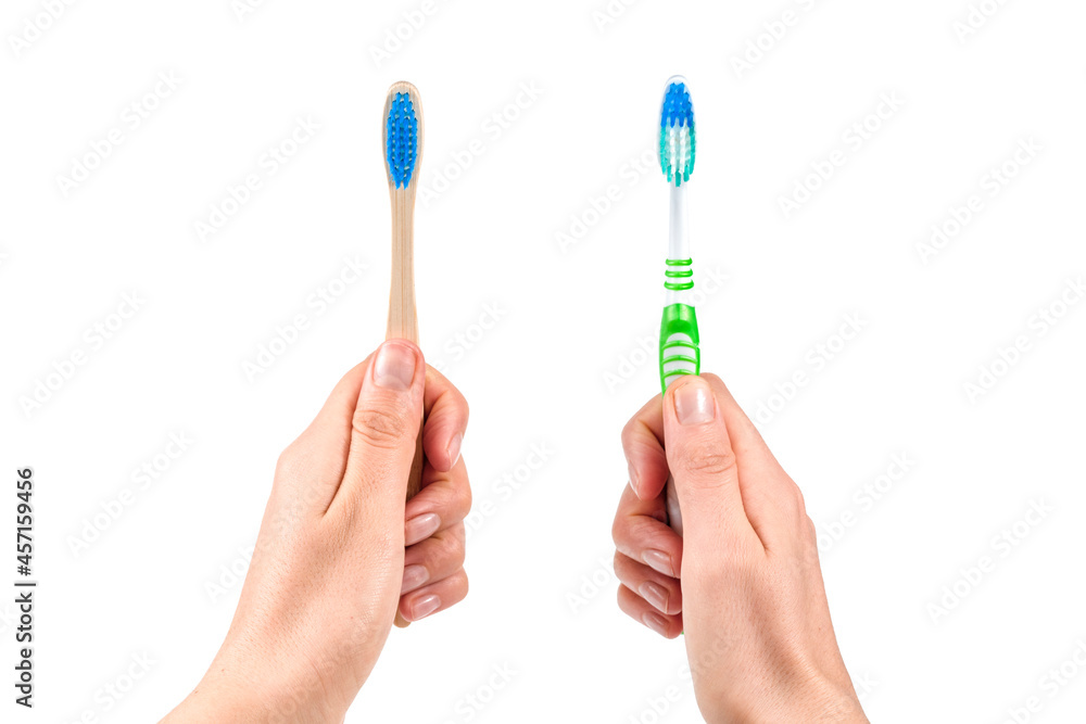 Hands with two toothbrushes on white background. Hands with two toothbrushes on white background.