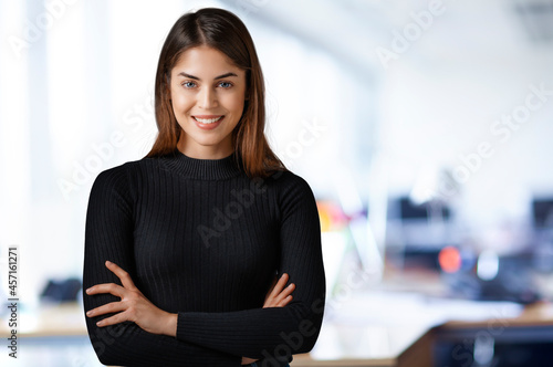 Portrait of smiling young businesswoman standing at the office