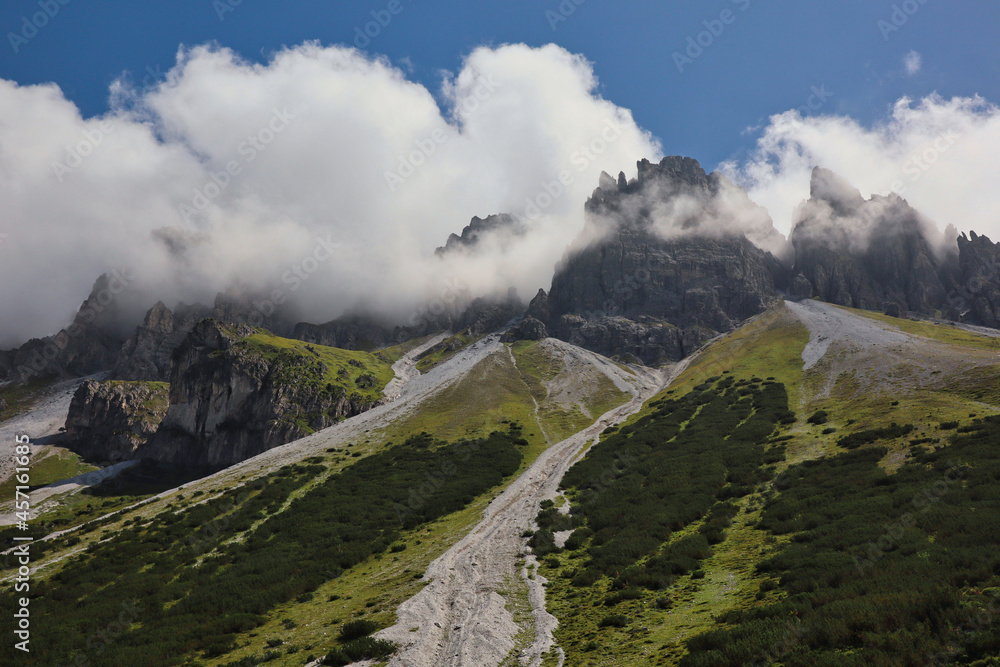 Austrian Kalkkoegel with Clouds in Tyrol. Beautiful View of Rock on a Green Hill during Summer in Austria.