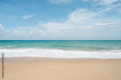beach and blue sky.Waves sea water crashing beach texture Background.Close up no people.