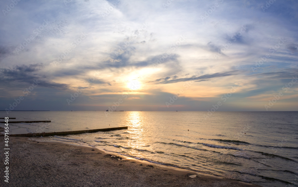 Sunset over the Baltic Sea on the beach in Zelenogradsk. Kaliningrad region, Russia Sunset over the Baltic Sea on the beach in Zelenogradsk. Kaliningrad region, Russia