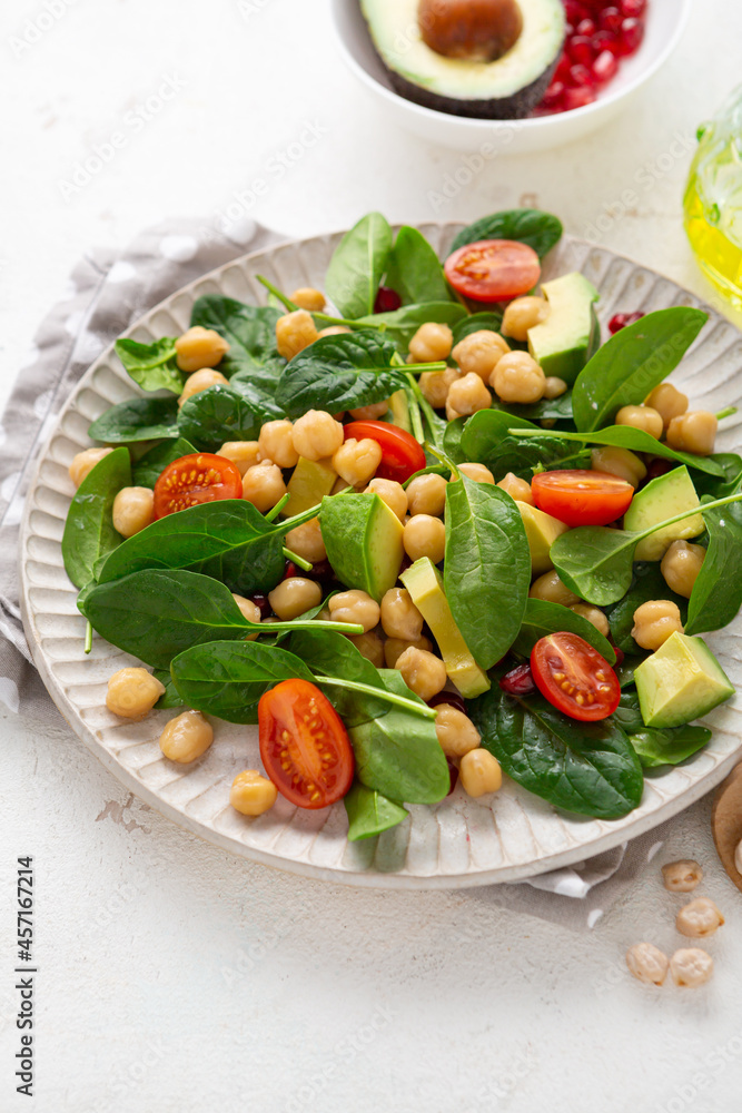 Close up of vegan slad with avocado chickpea and spinach