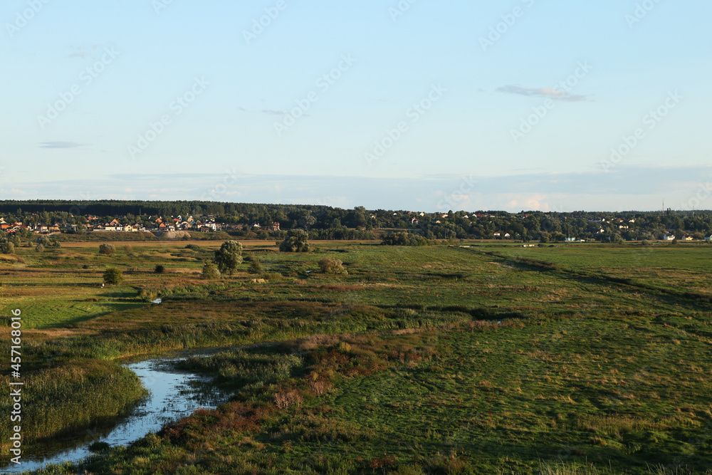 Fototapeta premium Village near field and river