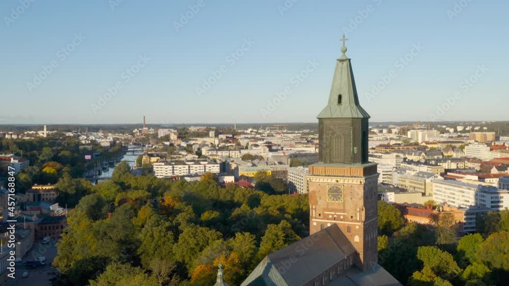 The tower of Turku Cathedral and the city center in the background in Turku, Finland in early autumn. The tower of Turku Cathedral and the city center in the background in Turku, Finland in early autumn.