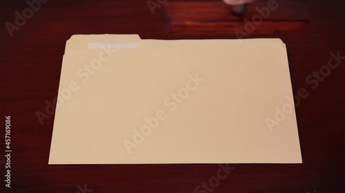 Folder being stamped 