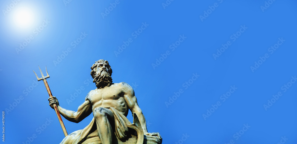 Mighty and powerful god of the sea, oceans and water Neptune (Poseidon) in sun rays. Copy space.