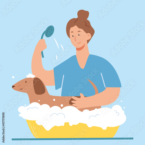 Veterinarian and dog at pet clinic. Services of veterinary clinic. 
Washing and caring about fur.