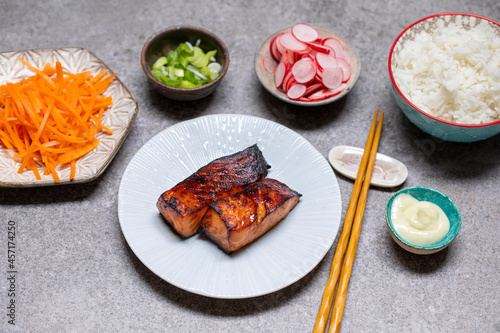 Japanese style meal with grilled salmon, rice and pickled vegetables