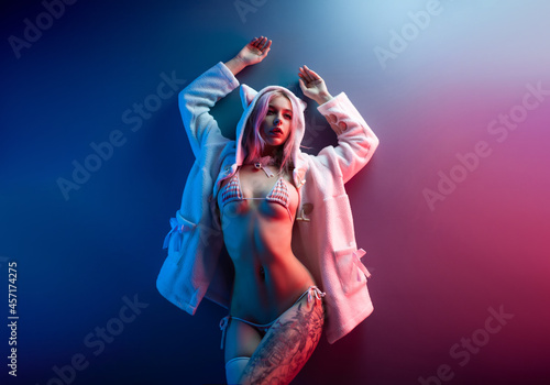 фотографія sexy young girl cosplay anime japanese style in underwear in neon light