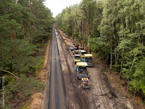 Aerial photo of road construction work in the countryside. Modern vehicles for making high-quality modern asphalt pavement