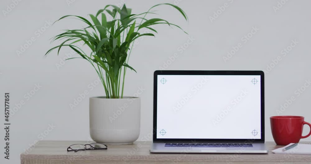 Animation of laptop on wooden table with copy space in office Animation of laptop on wooden table with copy space in office