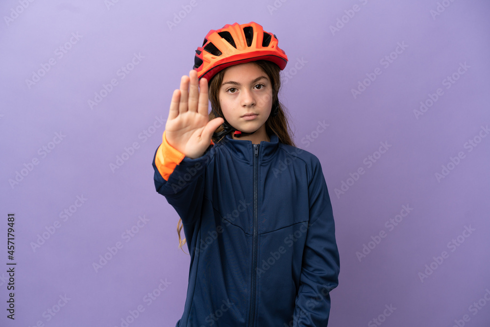 Fototapeta premium Little caucasian girl isolated on purple background making stop gesture
