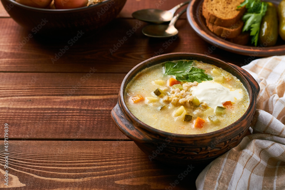 russian pickle soup with pearl barley and sour creame