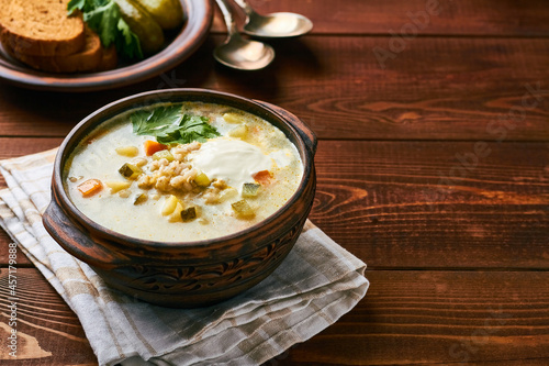 russian pickle soup with pearl barley and sour creame