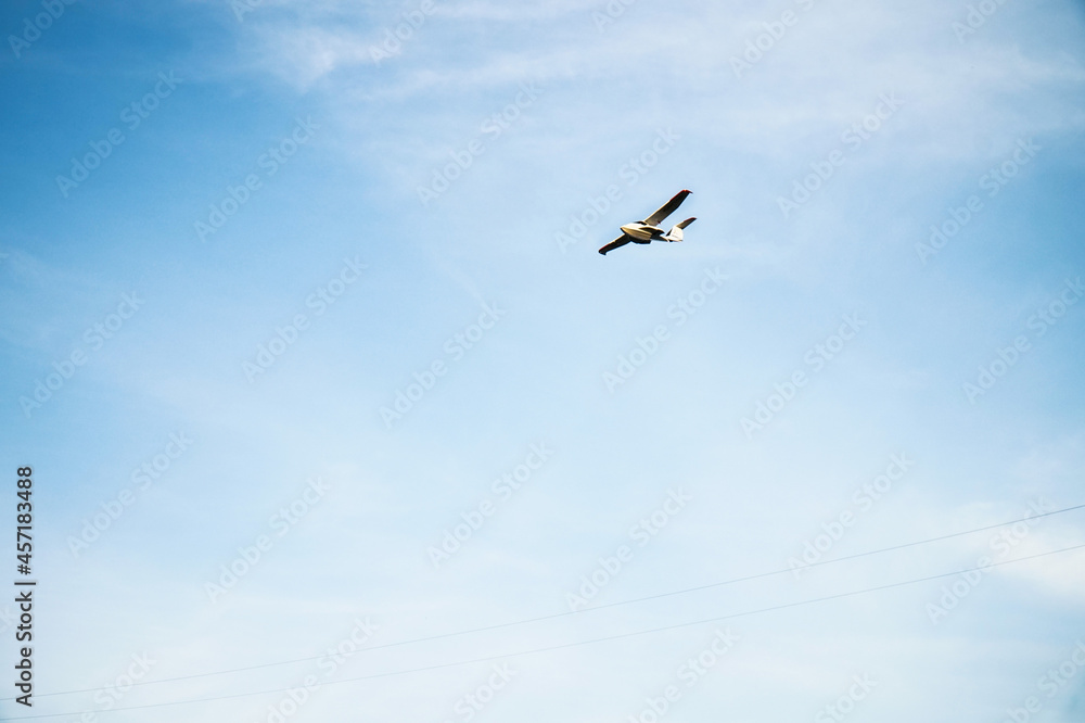 A small plane flying in the sky.  