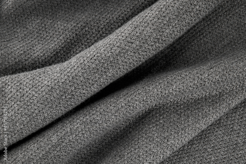 Fototapeta premium Men's winter sweater. Gray jumper on a white background. Cotton fabric texture. Gray cotton sweatshirt. 