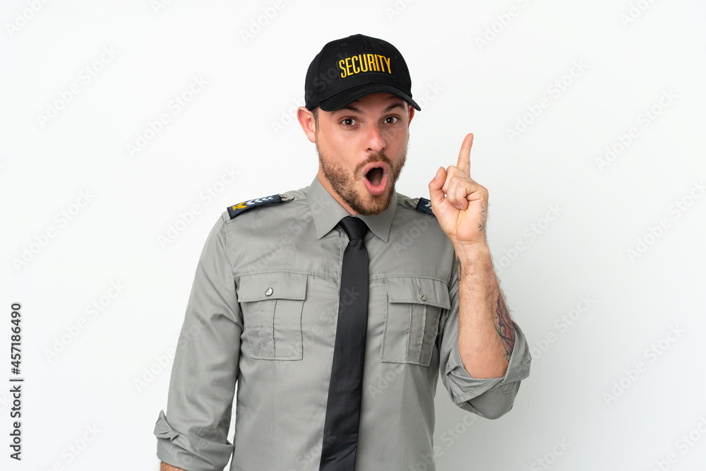 Young security Brazilian man isolated on white background intending to realizes the solution while lifting a finger up Young security Brazilian man isolated on white background intending to realizes the solution while lifting a finger up