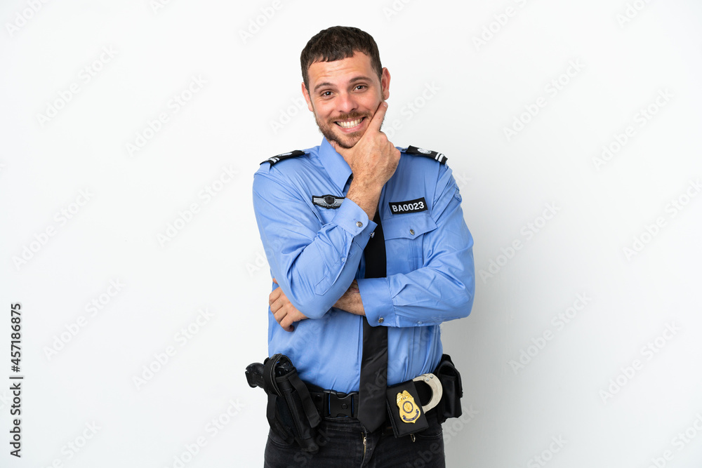 Young police Brazilian man isolated on white background happy and smiling Young police Brazilian man isolated on white background happy and smiling