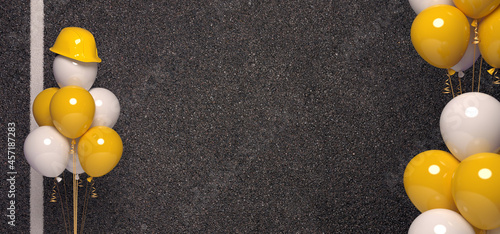 Photography Air balloons and protective helmet on a grey asphalt background