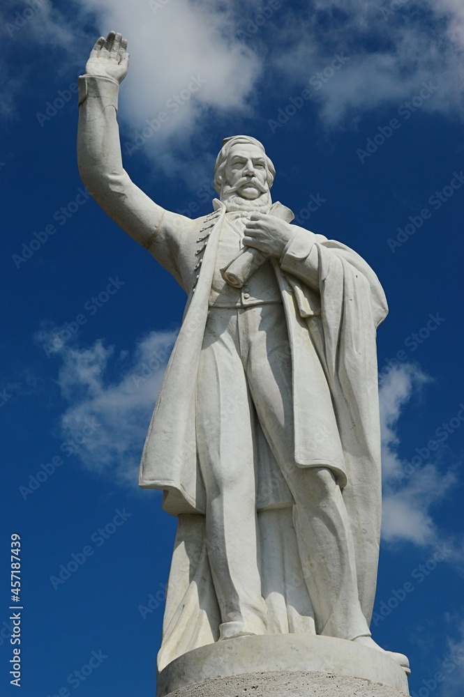 Front view of statue of Ludovit Stur, most famous 19th century Slovak writer, politician and author of Slovak language standard, located in Modra, Western Slovakia. Blue skies with clouds behind.