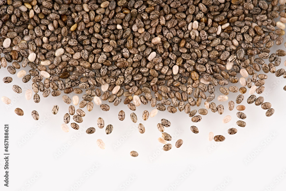 Chia seeds isolated with white background. Pile of healthy chia seeds background. Chia seeds isolated with white background. Pile of healthy chia seeds background.