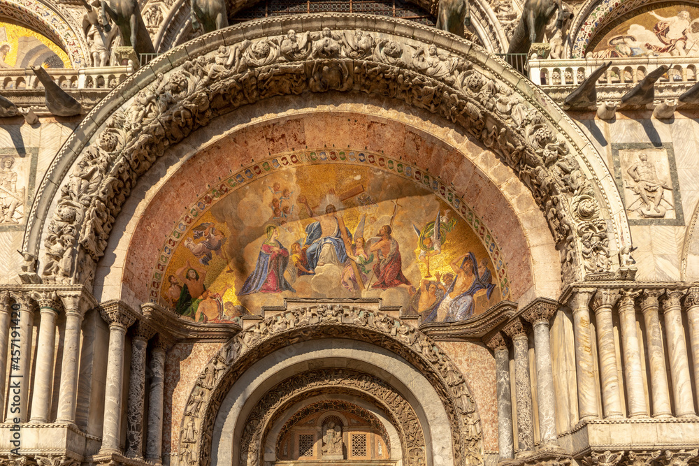 Fototapeta premium Fresco mosaic on the entrance facade of St. Mark's Basilica at St. Marks Square in Venice