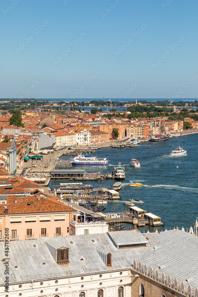 scenic view to St. Mark's square and coast of Venice with piers, vaporettos  and view to the lagoon, Venice, Italy