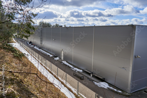 New factory building near the forest.