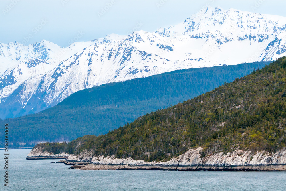 Rocky shoreline and mountains along the Inside Passage, Alaska