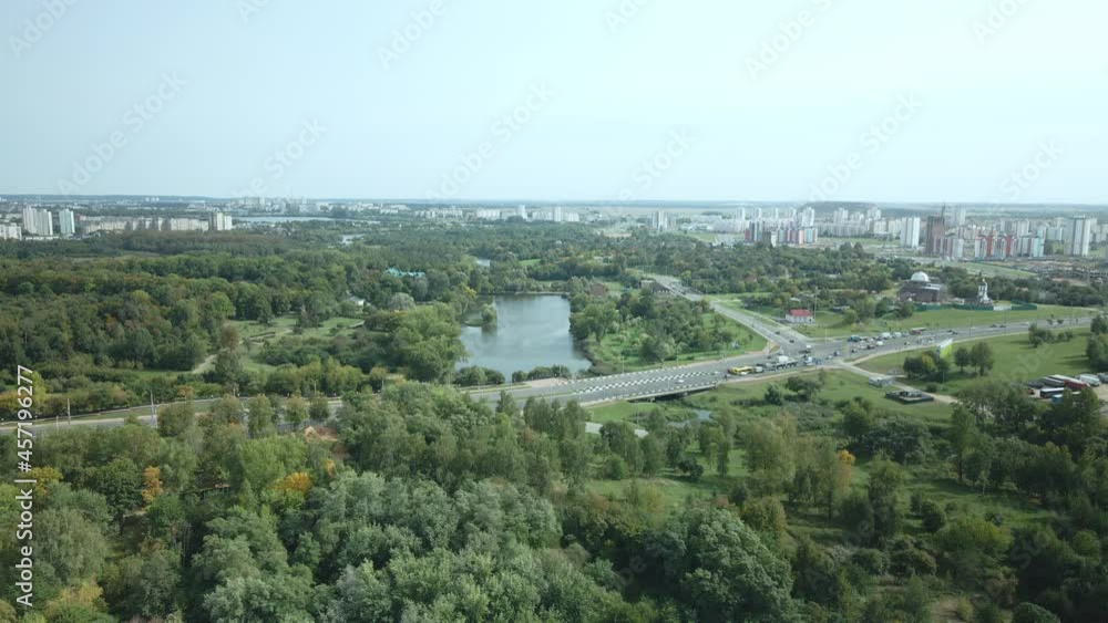 An overpass across the city river. Busy freeway. Aerial photography. An overpass across the city river. Busy freeway. Aerial photography.