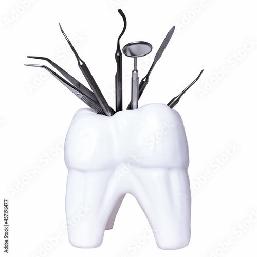 Dental professional steel tools in tooth shaped holder on white background. Set of metal medical equipment tools for teeth dental care. sickle probe, dental explorer, mirror, burnisher, forceps