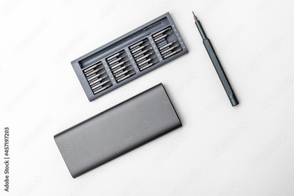 a set of small screwdriver bits in an open box a set of small screwdriver bits in an open box