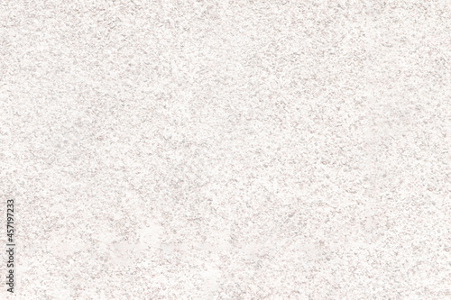 The mottled surface of the granite slab is finely speckled. Uniform texture of natural stone.