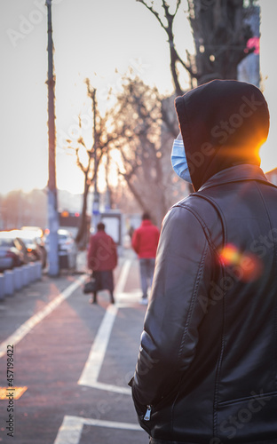 person in the street at sunset 
