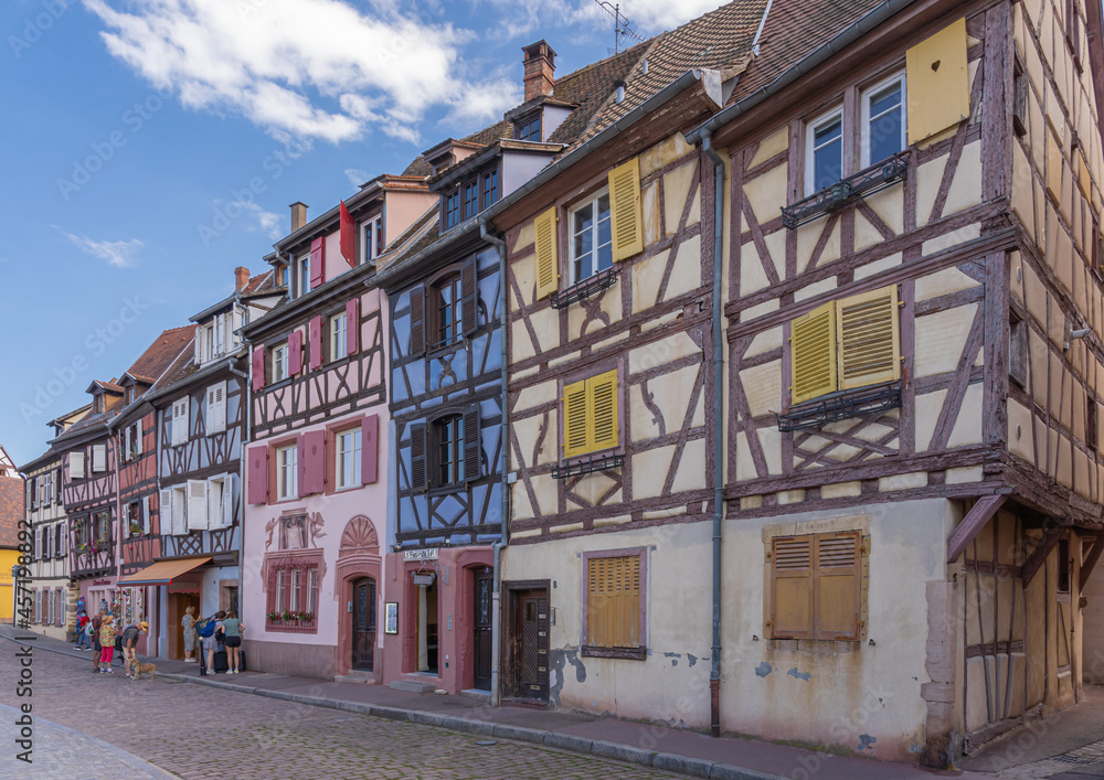 Obraz premium Colmar, France - 09 16 2021: Typical houses and colorful facades in downtown