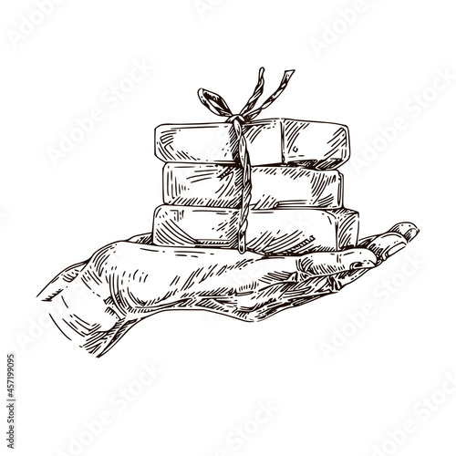 Stack of soap bars in the palm of your hand. Sketch. Engraving style. Vector illustration.