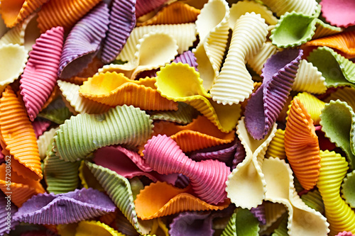 Lot of colorful Fischietti Pasta. Close-up. Culinary background