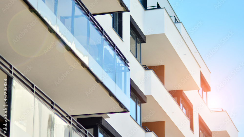 Modern apartment building on a sunny day. Architectural details and facade of a modern apartment building. Modern apartment building on a sunny day. Architectural details and facade of a modern apartment building.