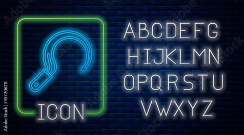 Glowing neon Sickle icon isolated on brick wall background. Reaping hook sign. Neon light alphabet. Vector