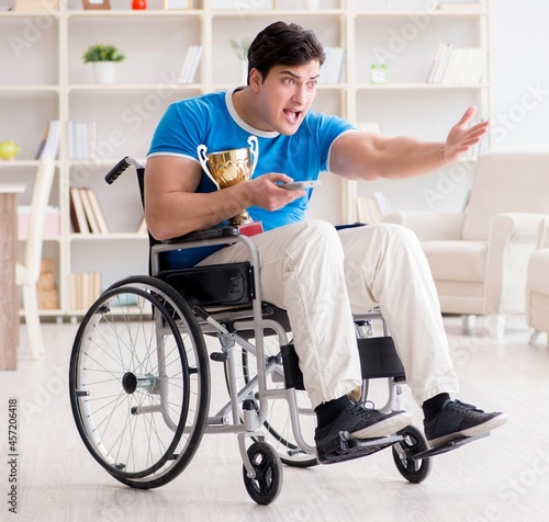 Disabled man watching sports on tv