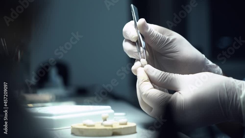 dental technician creates dental prostheses. laboratory. close-up.