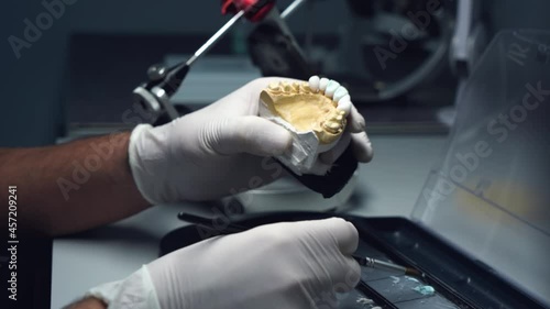 dental technician creates dental prostheses. laboratory. close-up.