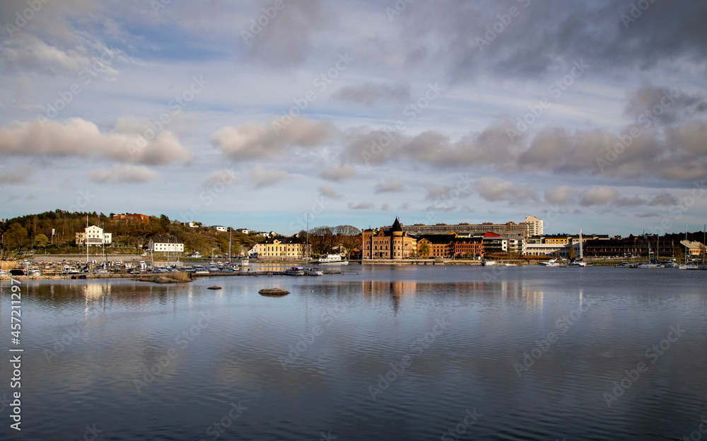 Gustavsberg. City embankment and pier under a cloudy sky